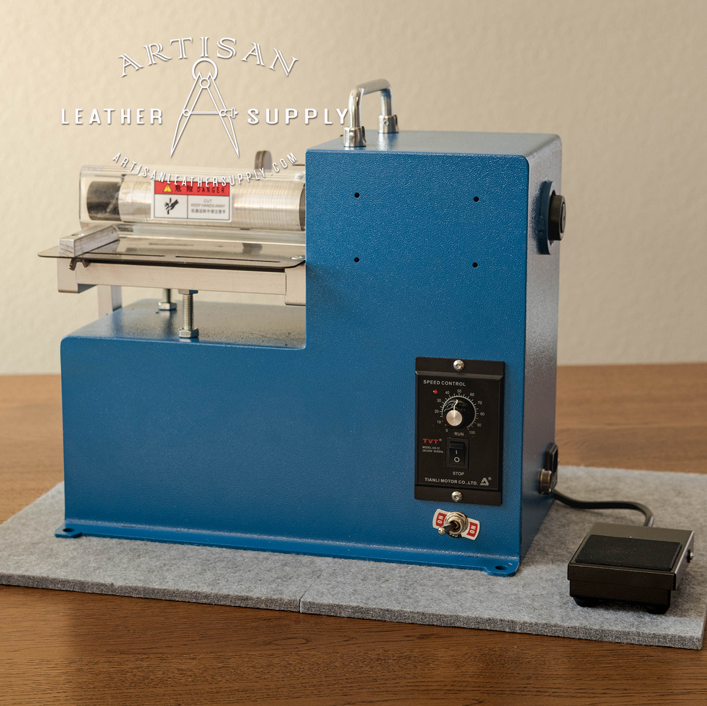 Artisan Leather Supply electric strap cutting machine. Features a speed control dial, foot pedal operation precision leather slitting.
